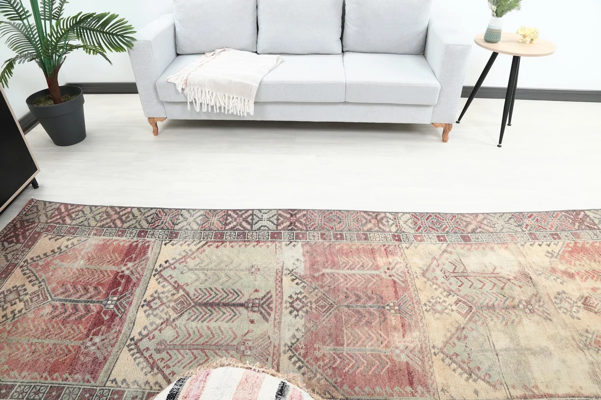 Overhead view showing the rug's length in the room, extending towards a gray couch