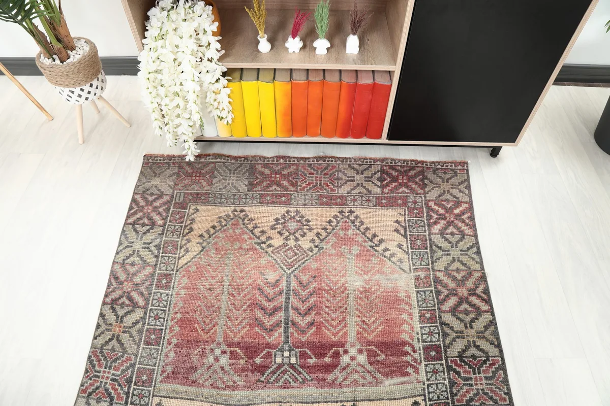 Detailed overhead shot of the rug's central motifs and border design