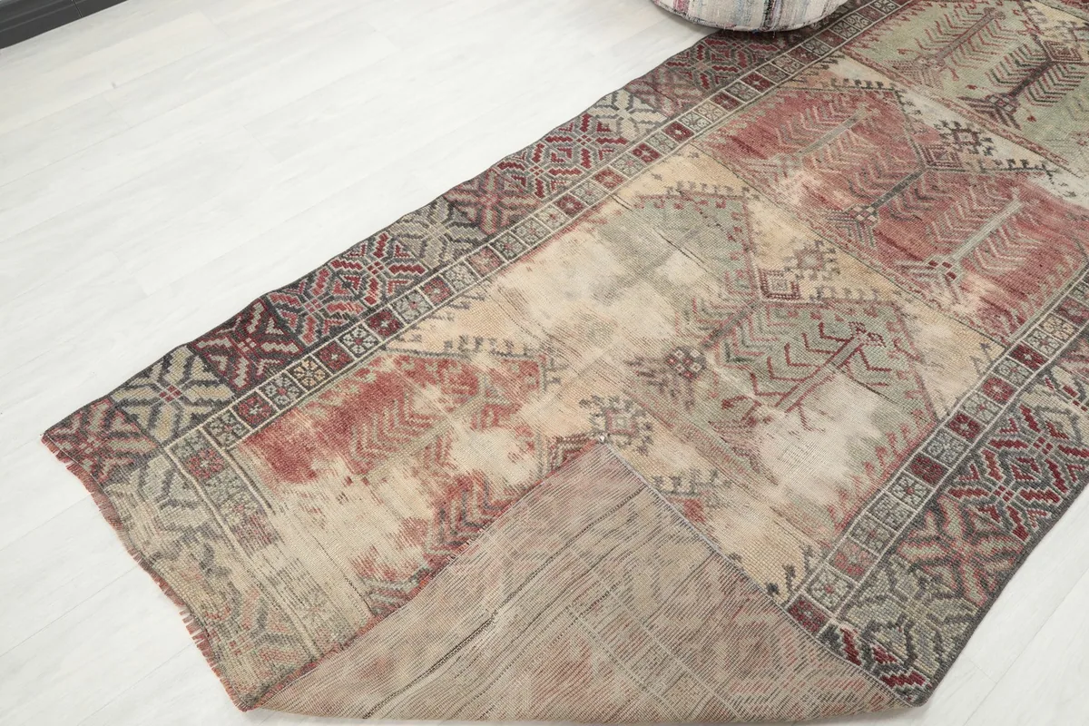The runner rug gently folded to show its flexibility and thickness