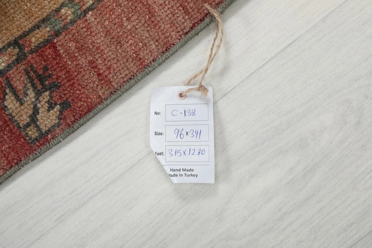 Tag showing the rug's dimensions and origin, confirming it is hand-made in Turkey