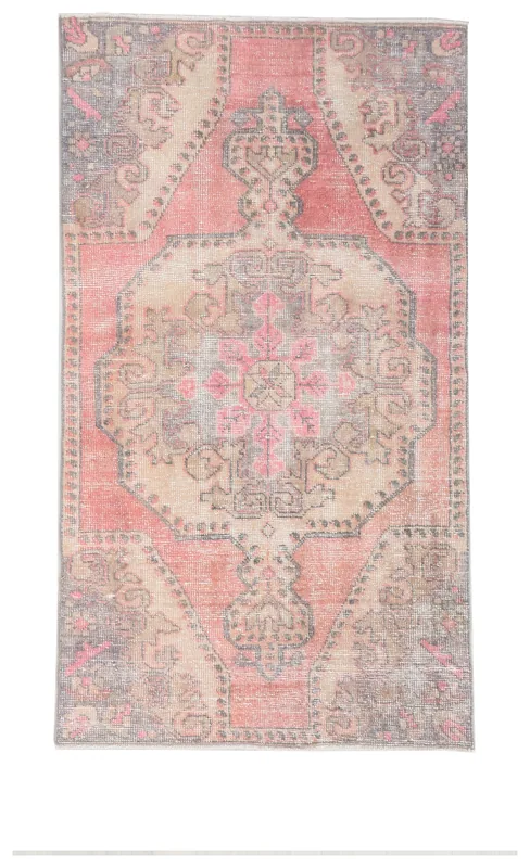 Full top view of the 3'7" x 6'6" rose and beige vintage Anatolian rug on a white background.