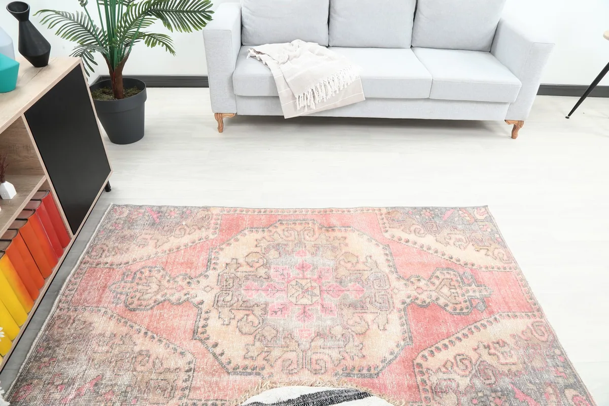 Overhead view of the rug within the room setting, highlighting its full pattern and colors.
