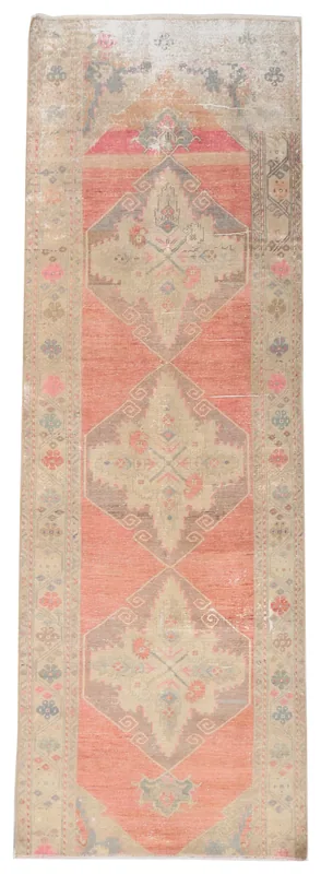 Full top view of the vintage Anatolian runner rug with rose and beige geometric patterns