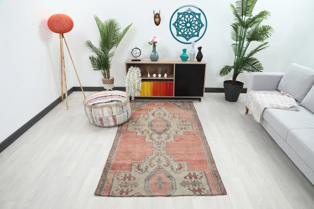 Vintage rose and beige runner placed in a modern living room setting, showing its scale and color