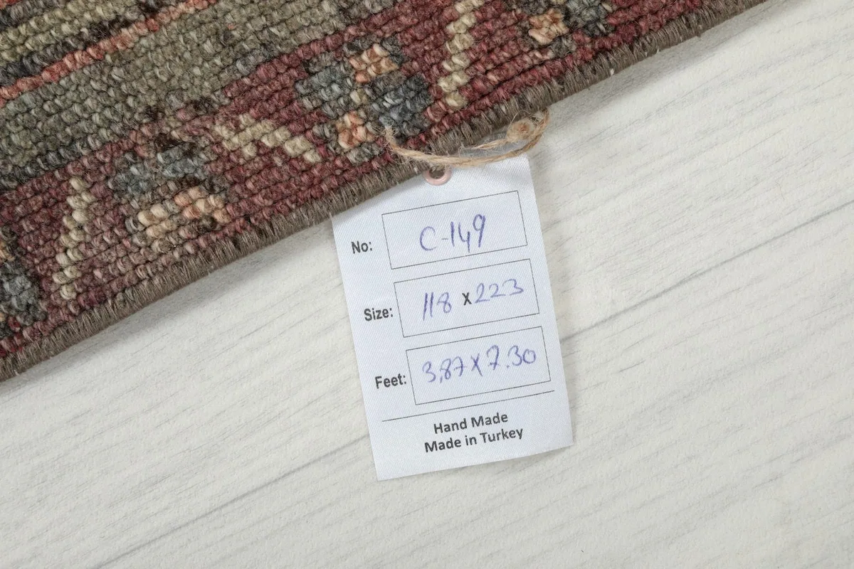 Tag showing the rug's dimensions and origin, confirming it is handmade from Turkey