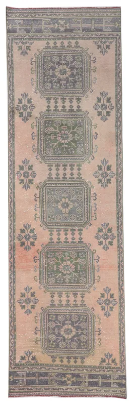 Top-down view of the 3'1" x 10'6" vintage Anatolian runner rug with rose field and gray geometric patterns.