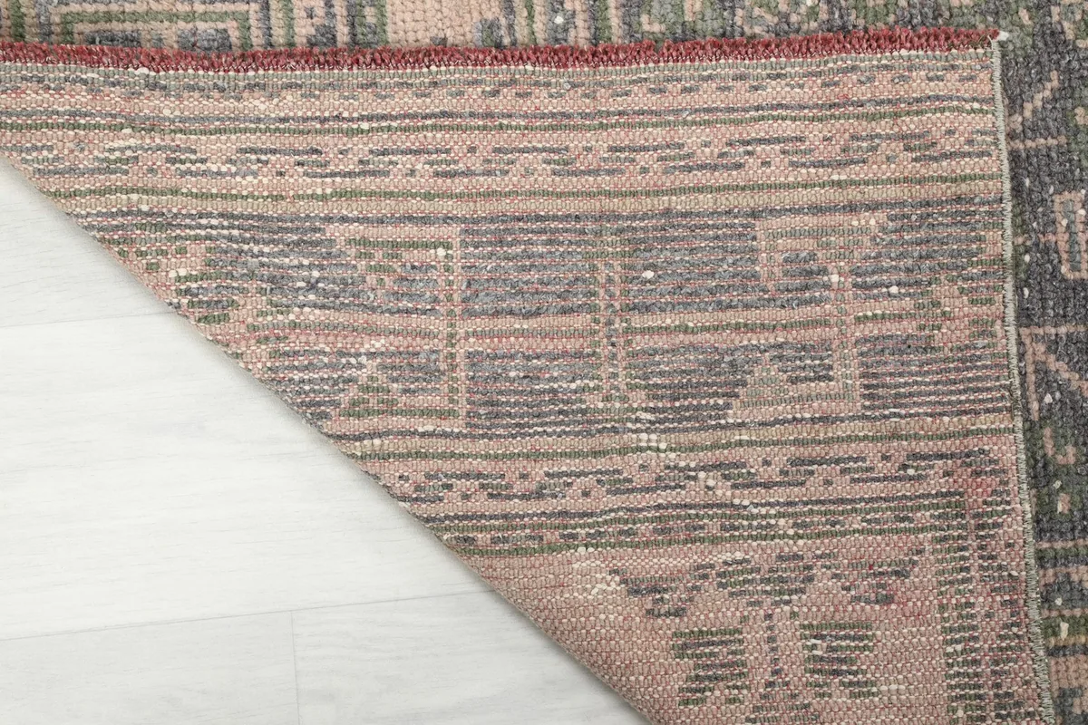Underside of the hand-knotted rug, displaying the cotton foundation and quality craftsmanship.