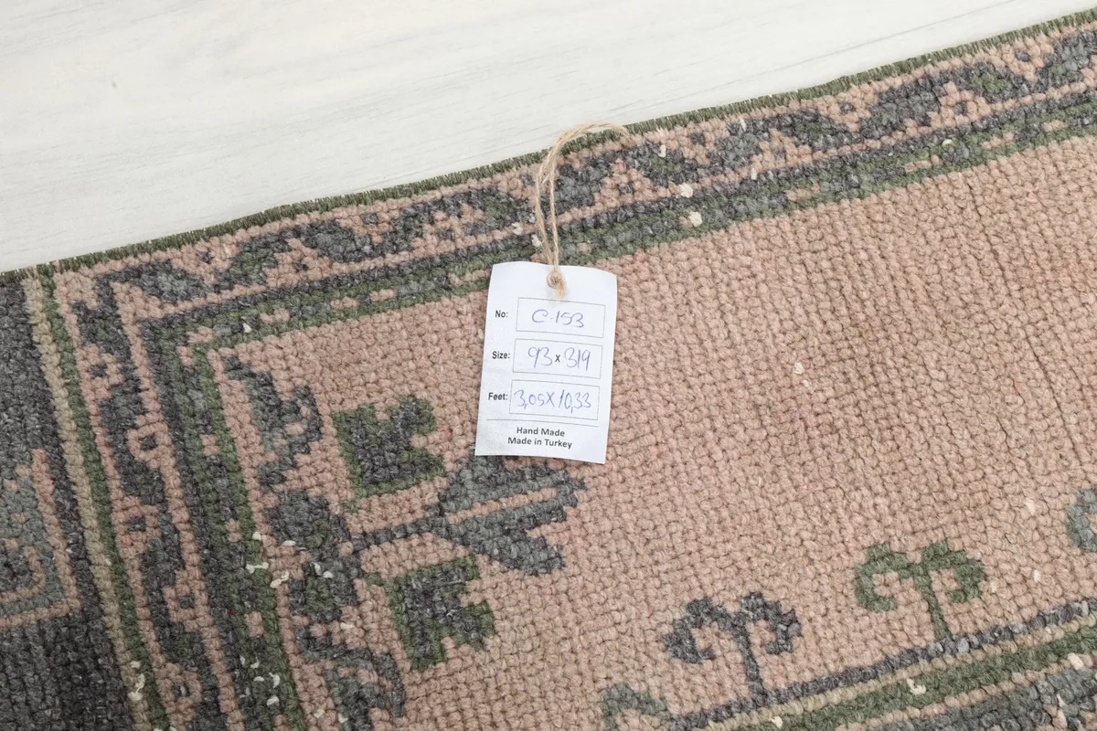 Tag on the vintage Anatolian runner rug, indicating its origin and size.