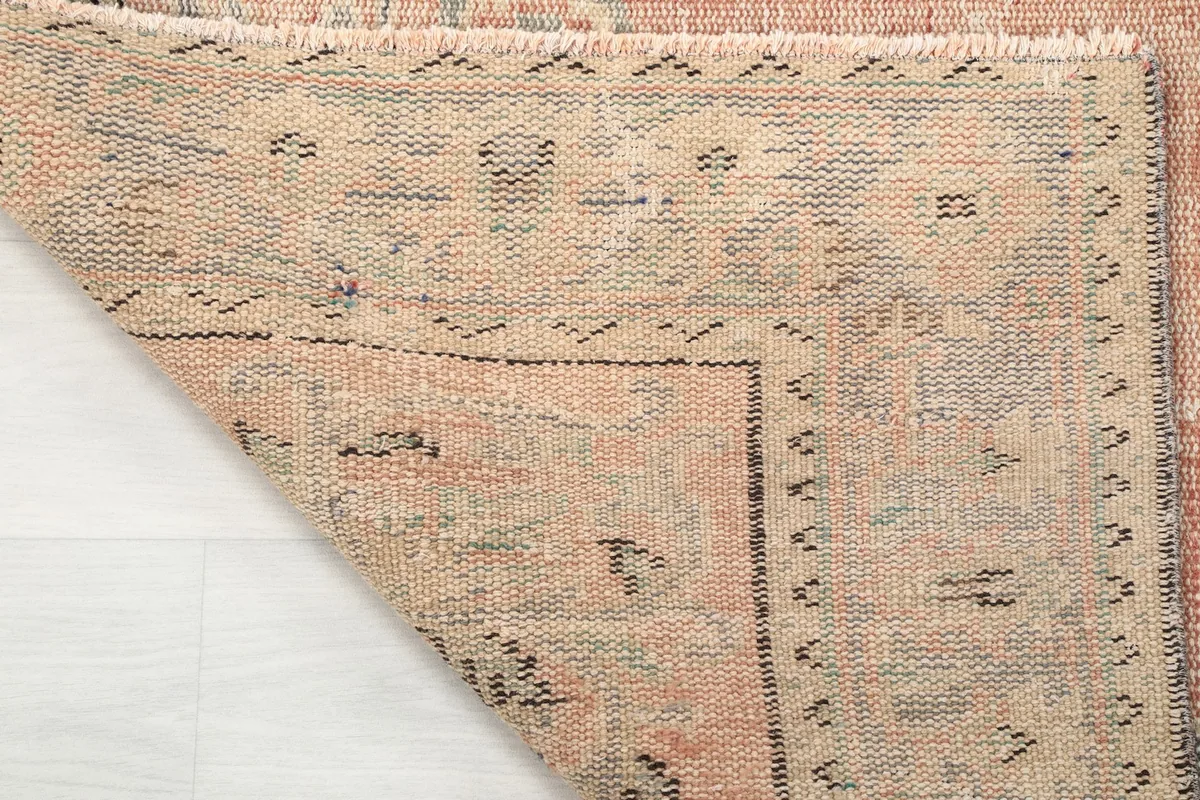 Underside view of the hand-knotted wool pile on cotton foundation, showing the rug's construction