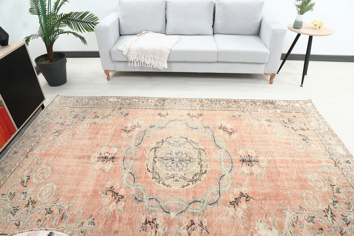 Overhead view of the rose medallion rug in a room, highlighting the central design and border