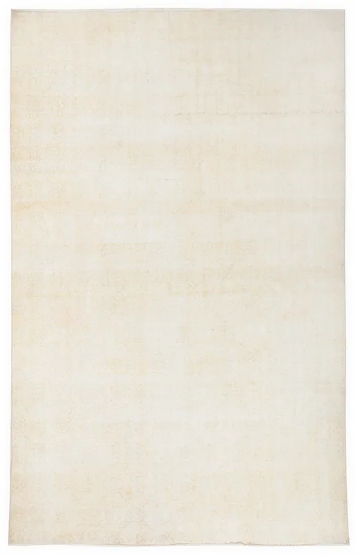 Full overhead view of the 7x11 muted ivory vintage Anatolian rug on a white background