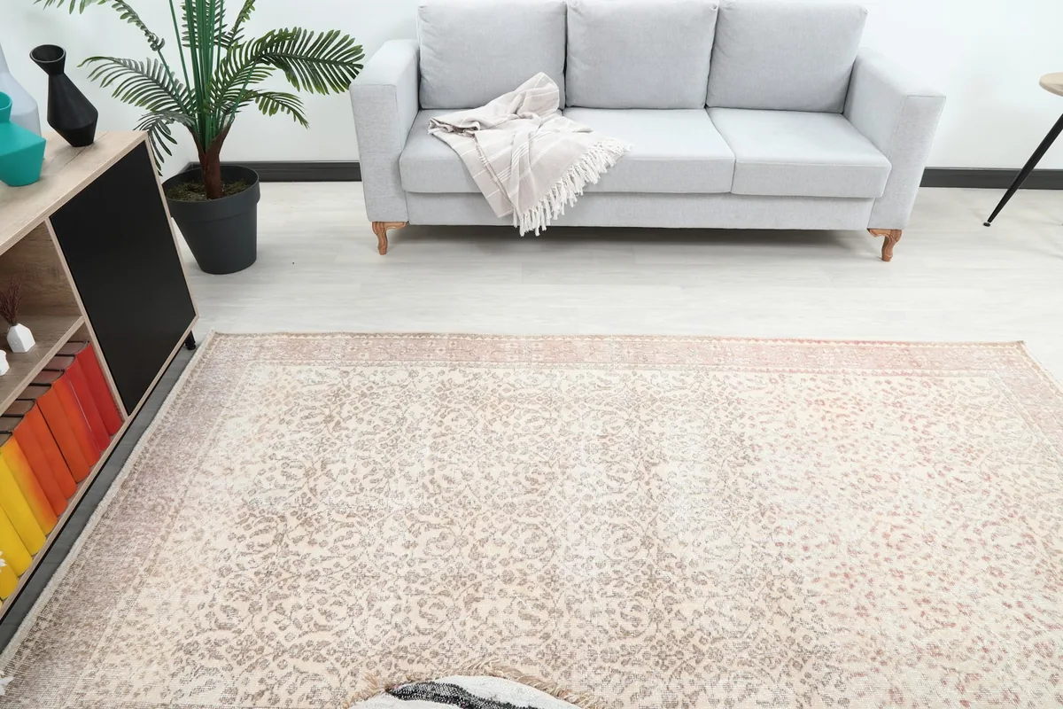 Overhead view of the rug in a room, showing its placement in front of a sofa