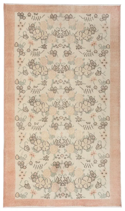 Full overhead view of the vintage Anatolian rug with ivory field and rose border