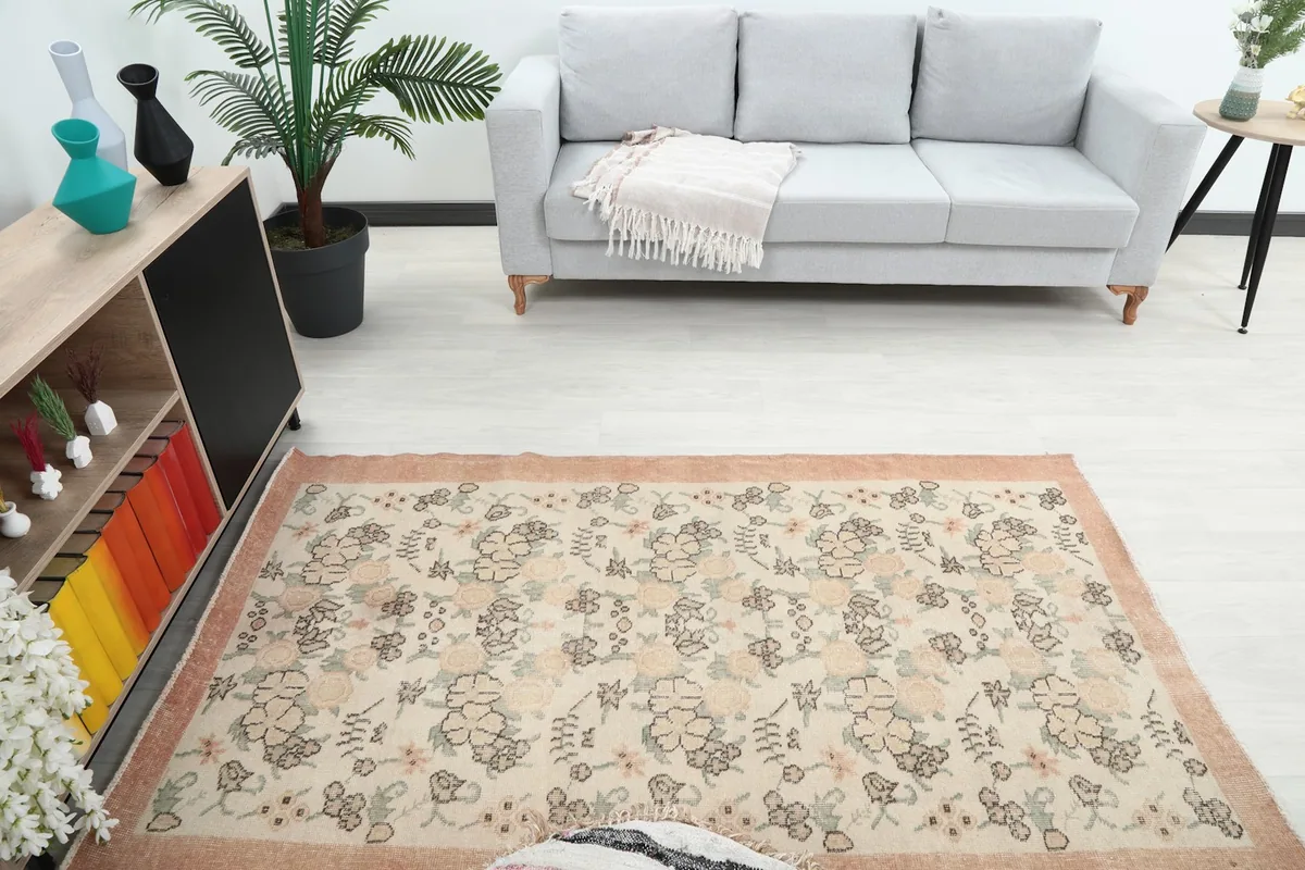 Overhead view of the rug in a room, showing its full length in front of a sofa