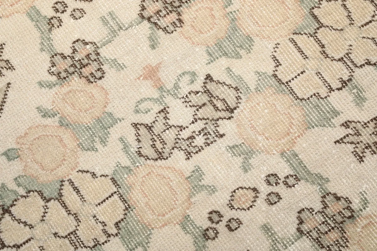 Close-up of the low wool pile and intricate hand-knotted floral design