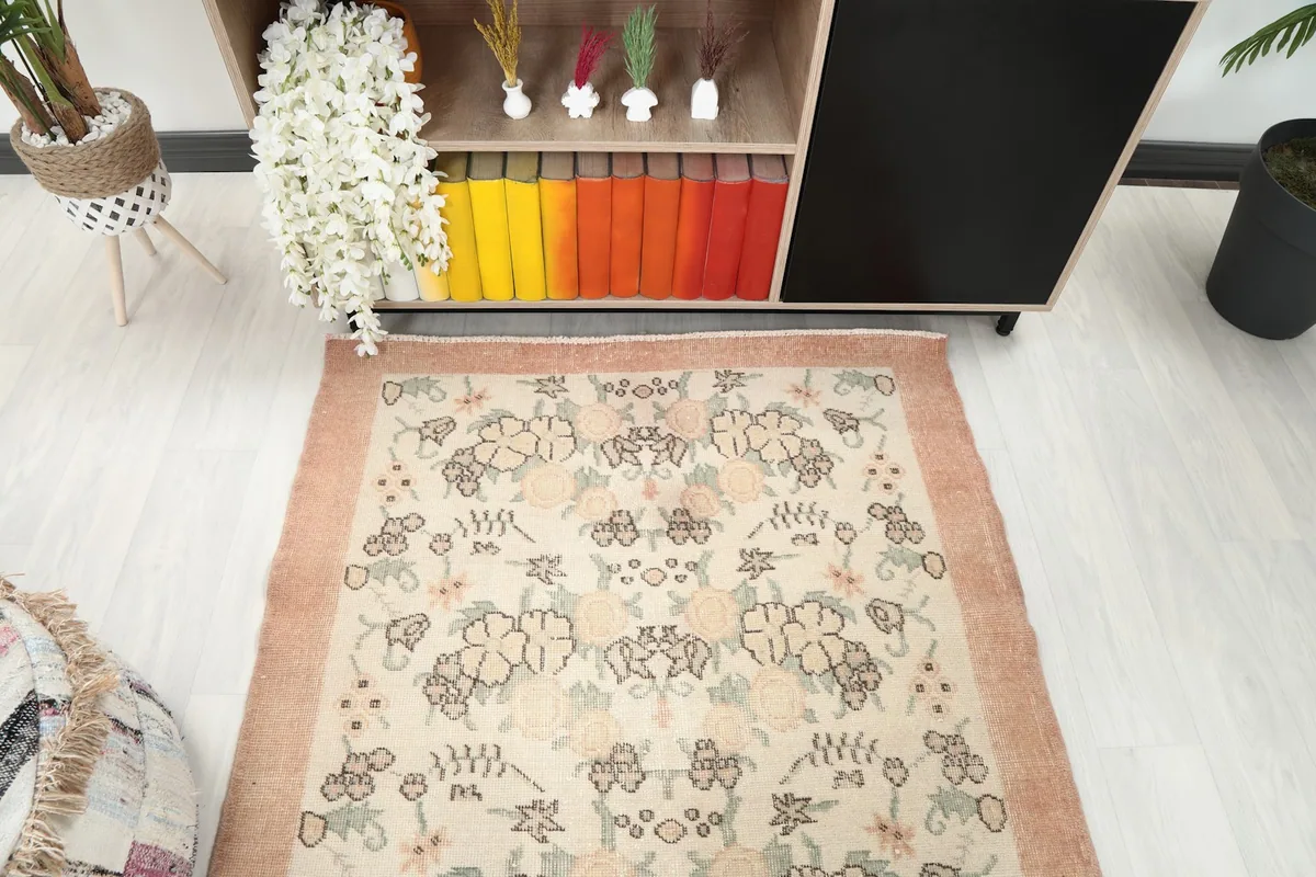 Overhead view focusing on the central floral pattern and rug proportions