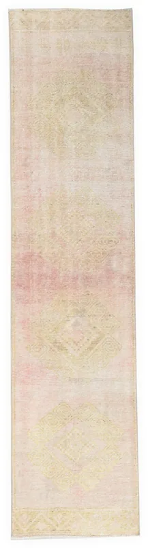 Full overhead view of the 2'6" x 10'7" rose and cream vintage Anatolian runner rug