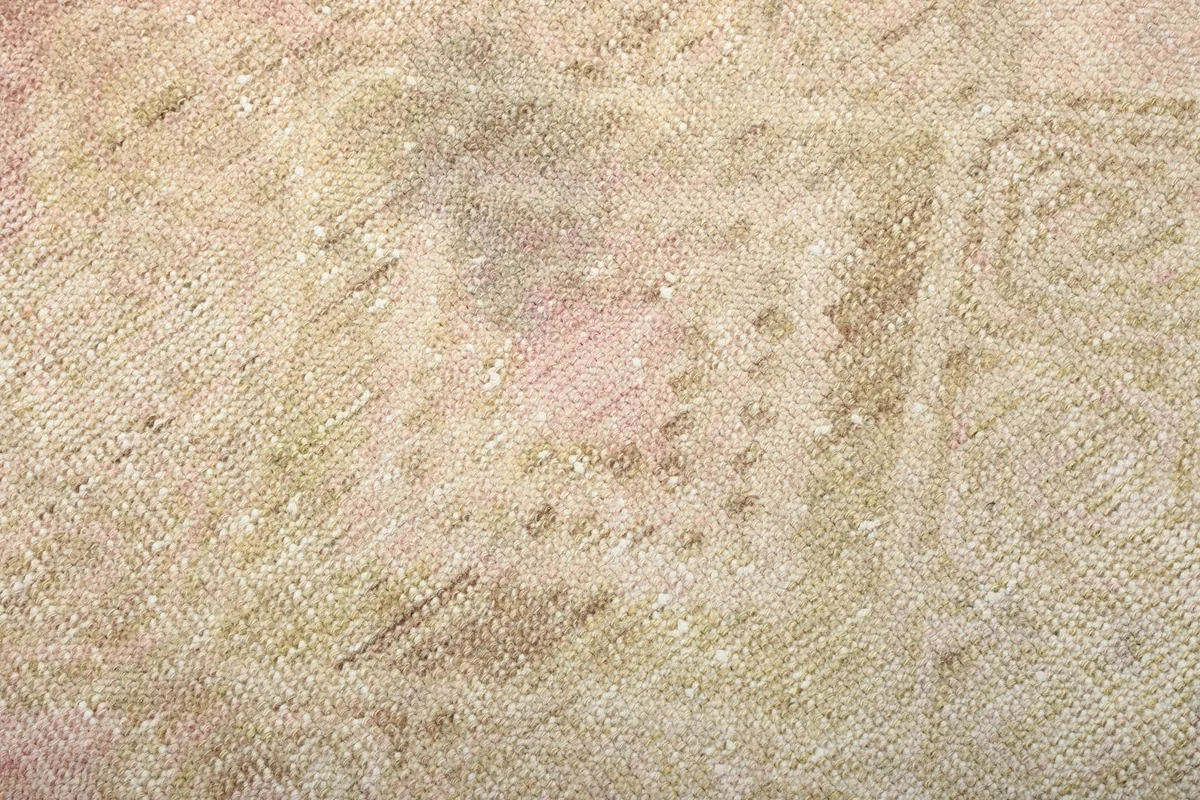 Close-up of the low wool pile and hand-knotted texture of the vintage Anatolian rug