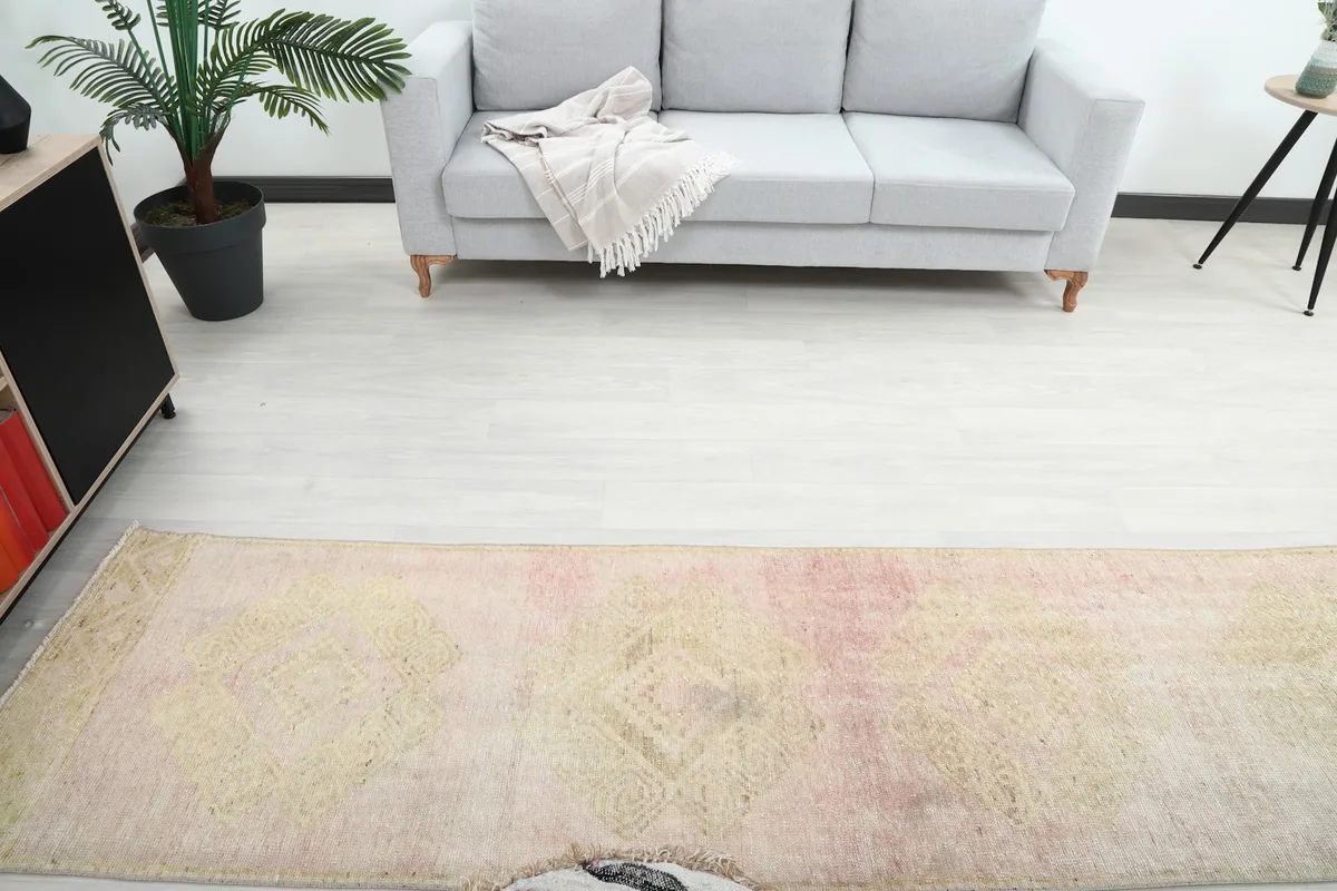 Overhead view of the vintage runner rug in a room, showing its length and placement