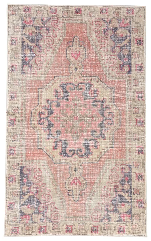 Top view of the 4'4" x 7'0" rose, navy, and beige vintage Anatolian rug