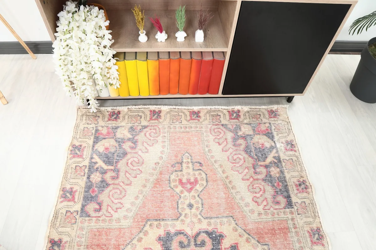 Overhead perspective of the rose and navy medallion rug from Anatolia