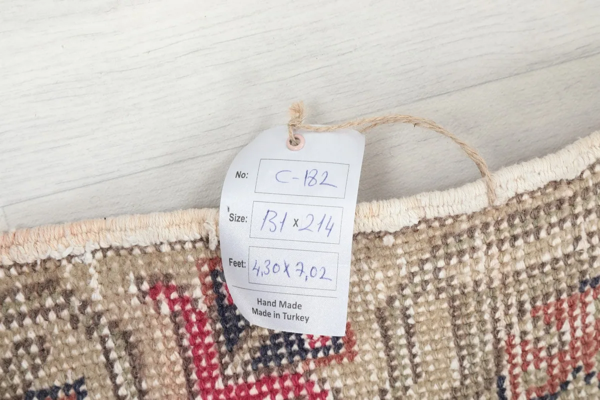 Product tag showing the rug's dimensions and origin as hand made in Turkey