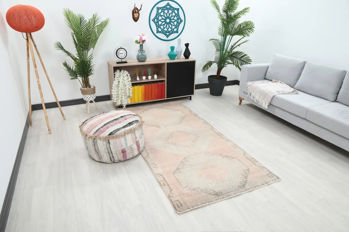 Angle view of the rose geometric runner rug adding warmth to a modern living space.