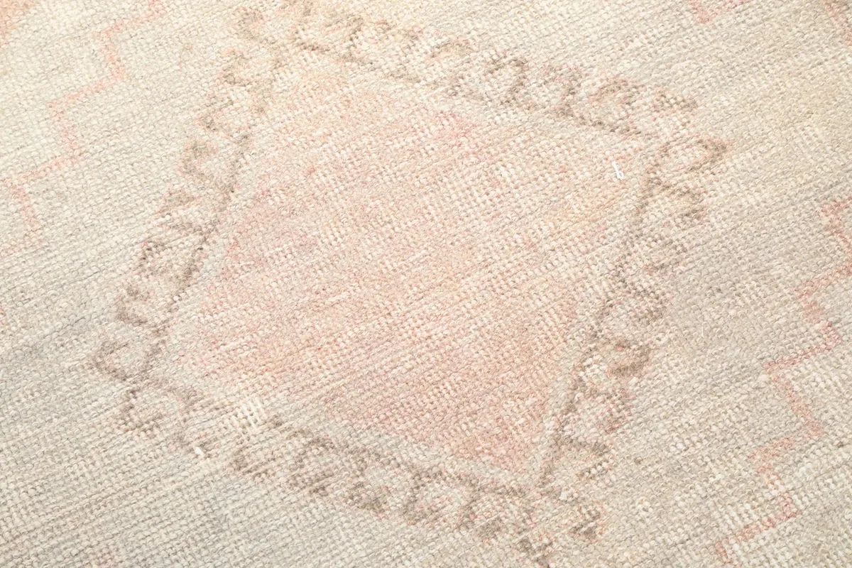 Detailed view of the intricate geometric pattern and texture of the hand-knotted wool.