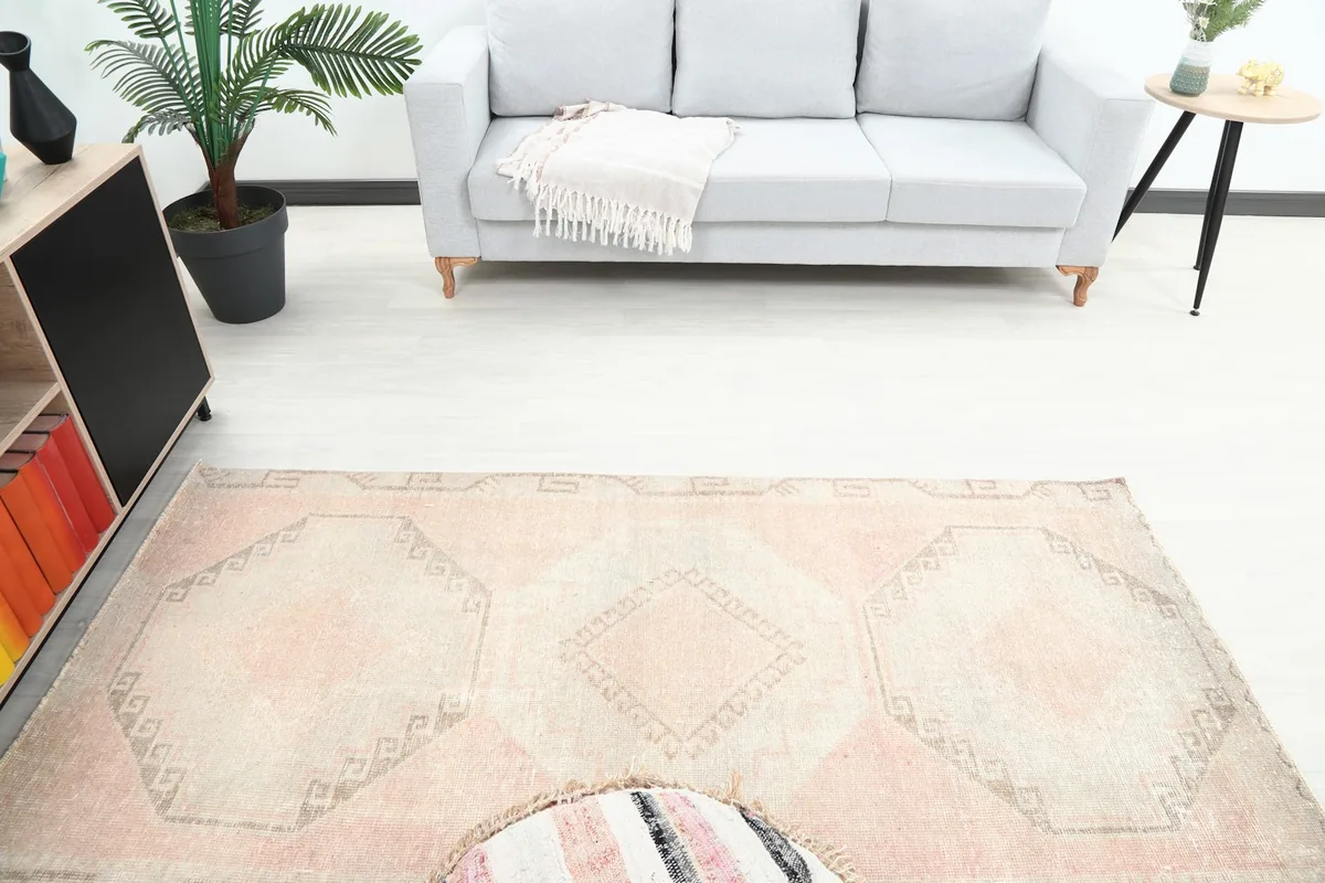 Overhead view of the vintage runner rug showcasing its full geometric design in a room setup.
