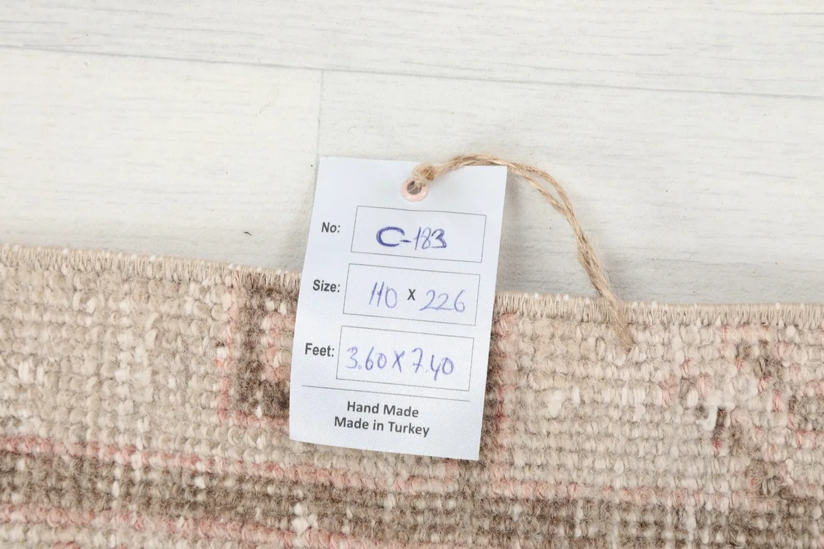 Tag showing the rug's size and origin, confirming it is hand-made in Turkey.