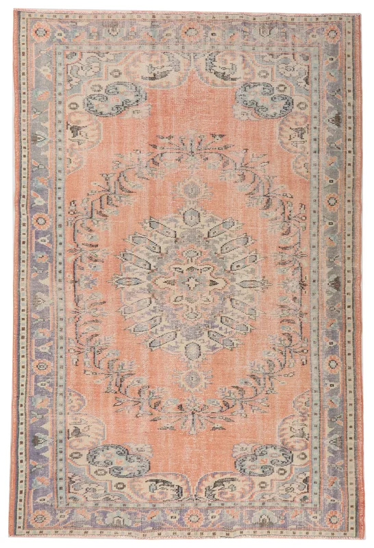 Full overhead view of the orange and blue vintage Anatolian area rug