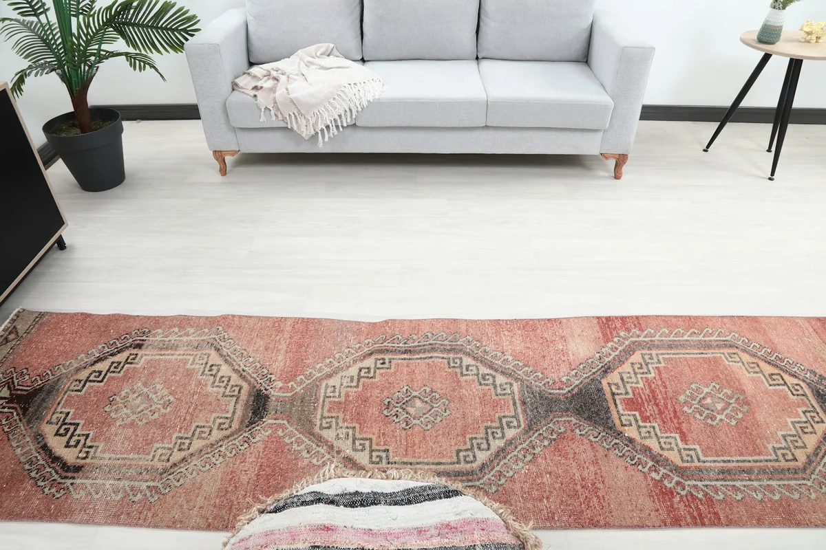 Overhead view of the runner rug showing its length in a room with a sofa