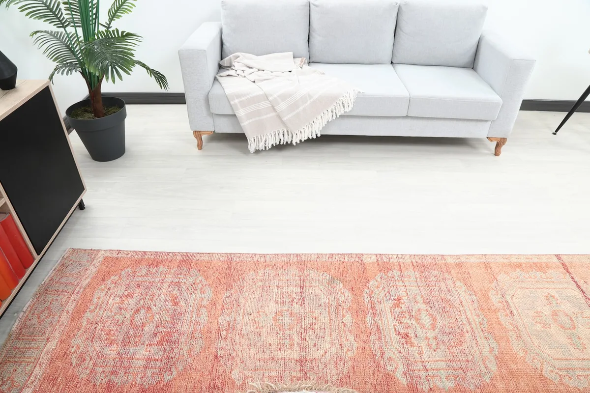 Overhead view of the runner rug in the room, showing its placement in front of a gray sofa