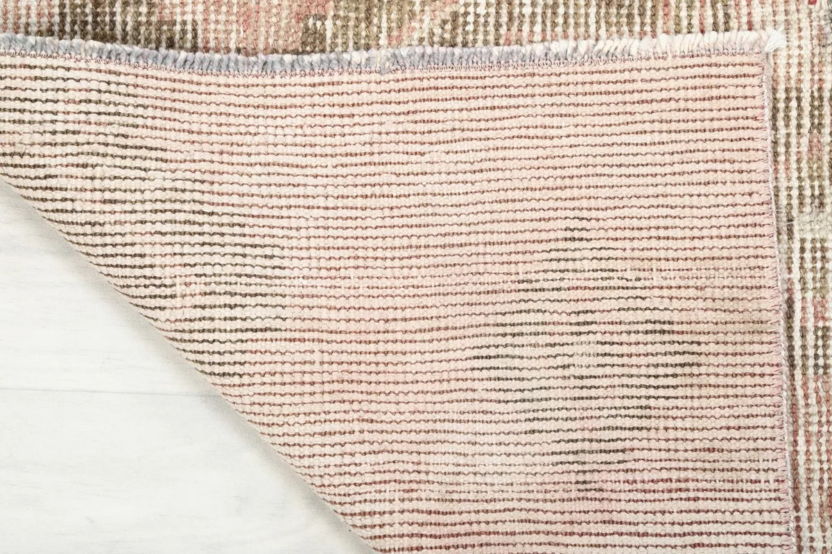 Full view of the back of the vintage hand-knotted runner, showcasing the cotton foundation.