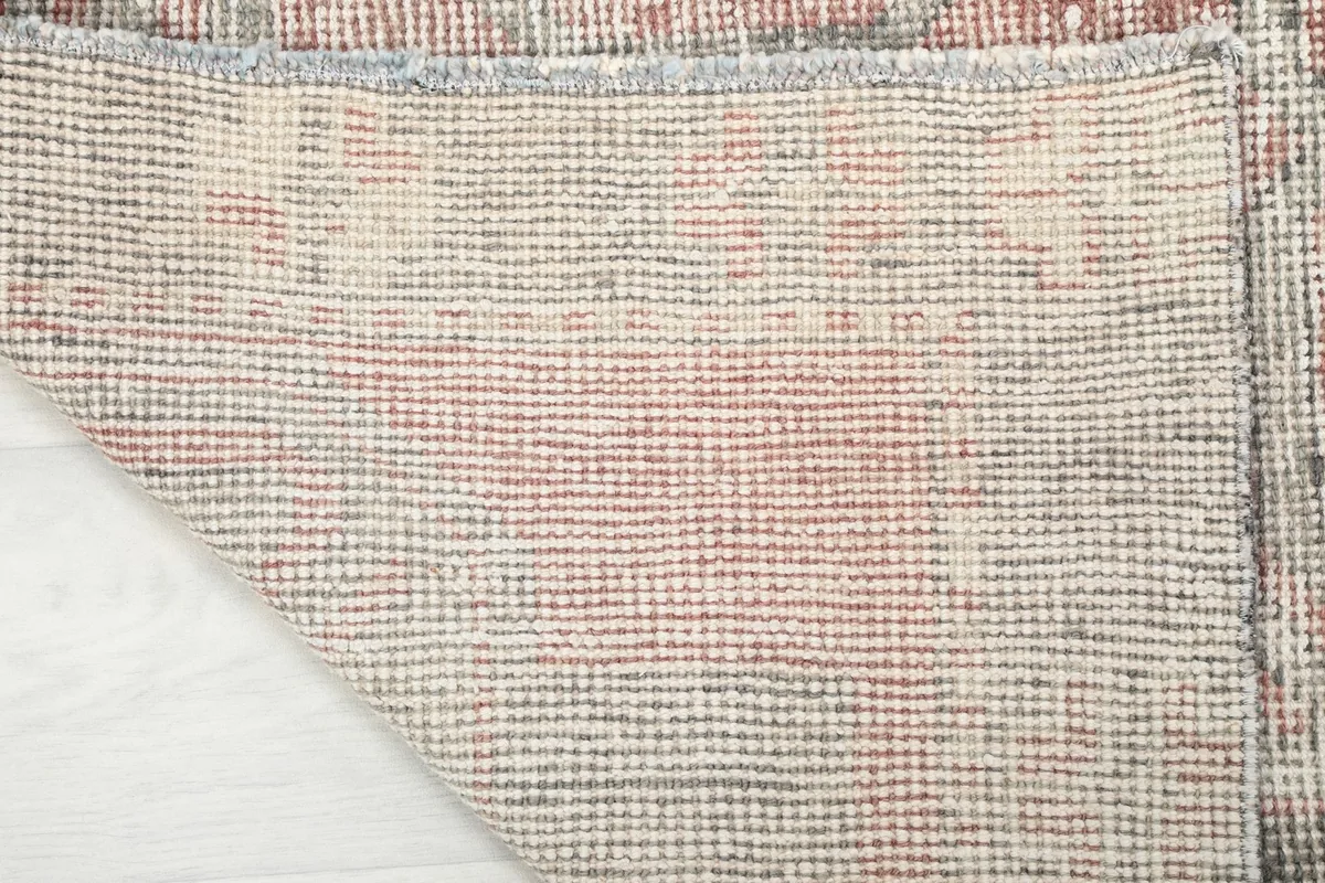 Close-up of the reverse side of the runner rug, revealing the intricate hand-knotting.