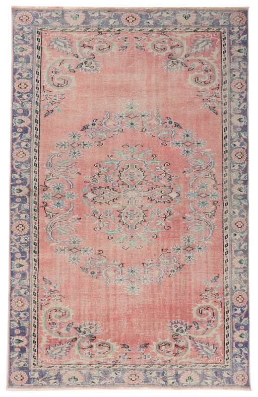 Full overhead view of the 5'9" x 9'0" faded rose Anatolian medallion rug on a white background.