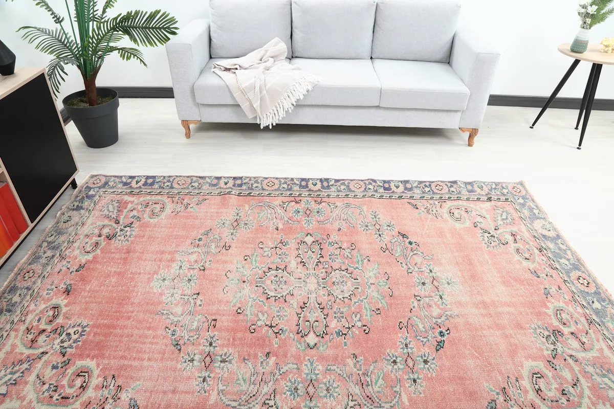 Overhead view showing the rug's placement in a room, highlighting the central medallion design.