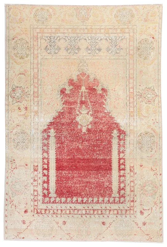 Full overhead view of the hand-knotted vintage Anatolian rug with a rust mihrab design and beige border.