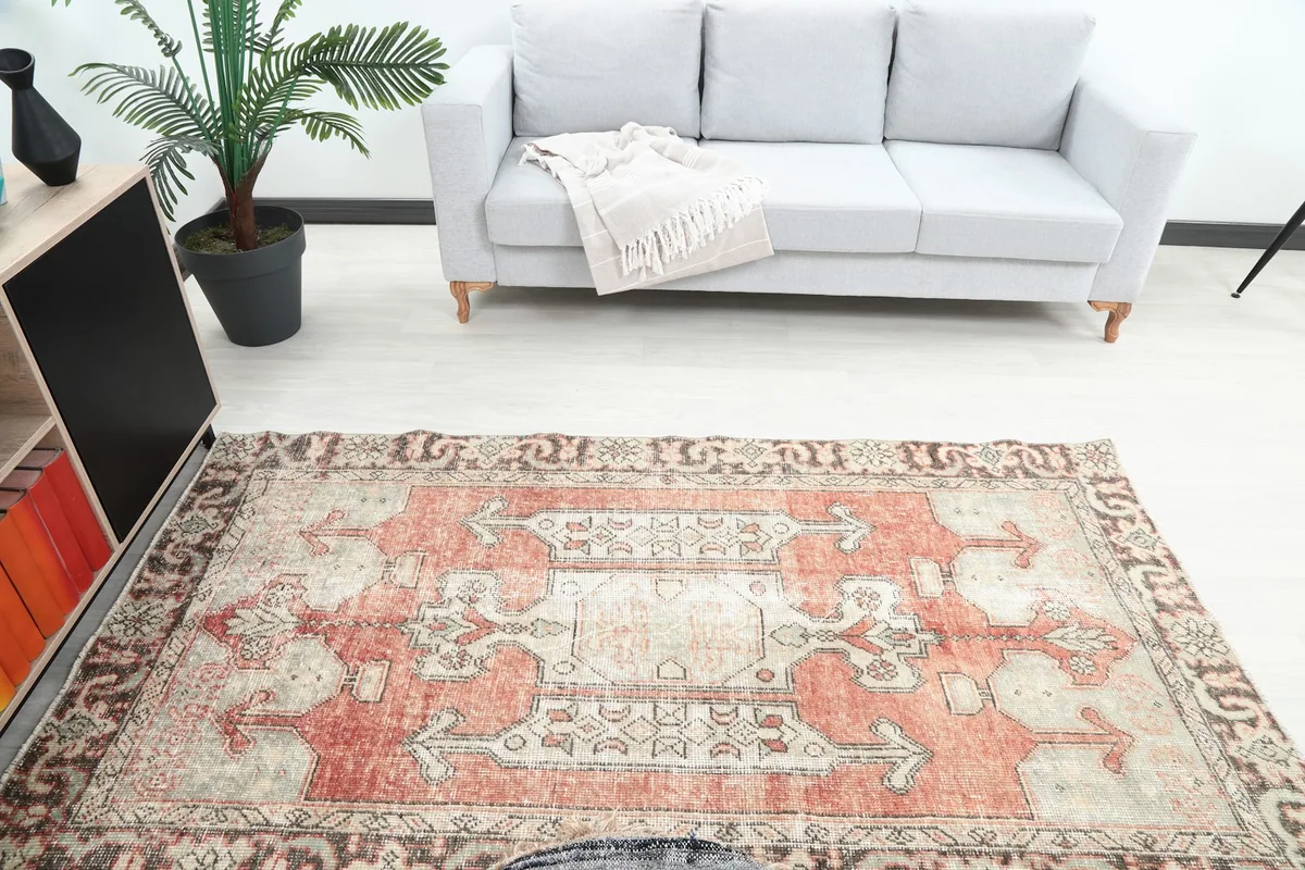 Overhead view of the rug in a room setting, highlighting its placement relative to a sofa