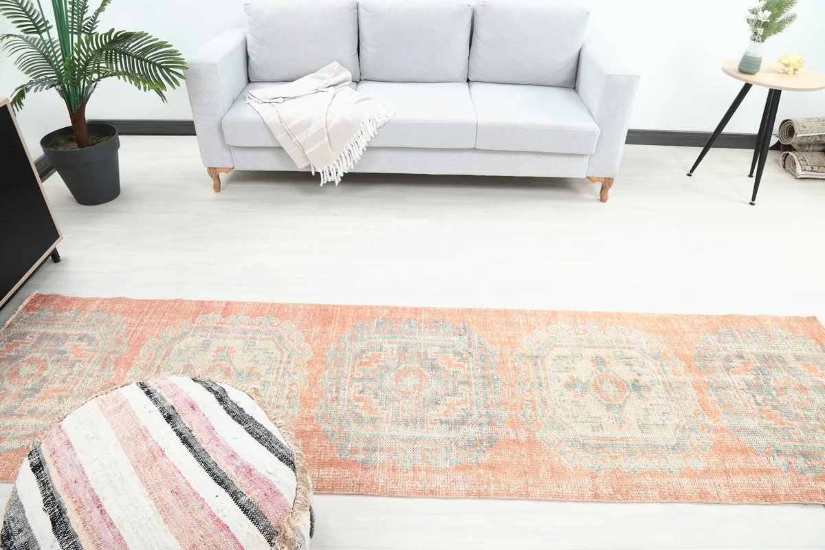 Overhead view of the rust runner rug in a room, showing its placement relative to furniture