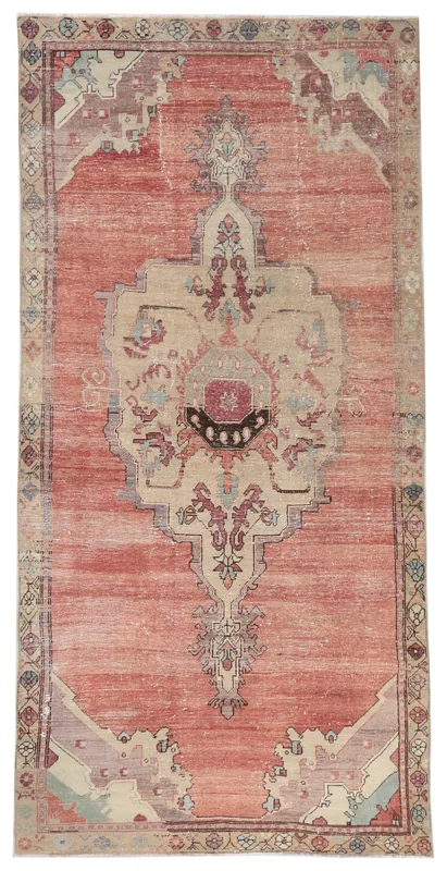 Full top view of the vintage Anatolian rose and beige medallion area rug on a white background.