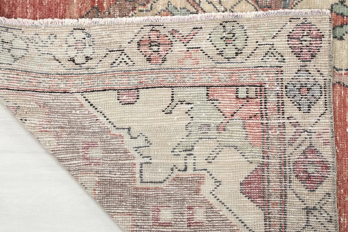 Close-up of the reverse side of the rug, showcasing the hand-knotted construction and foundation.