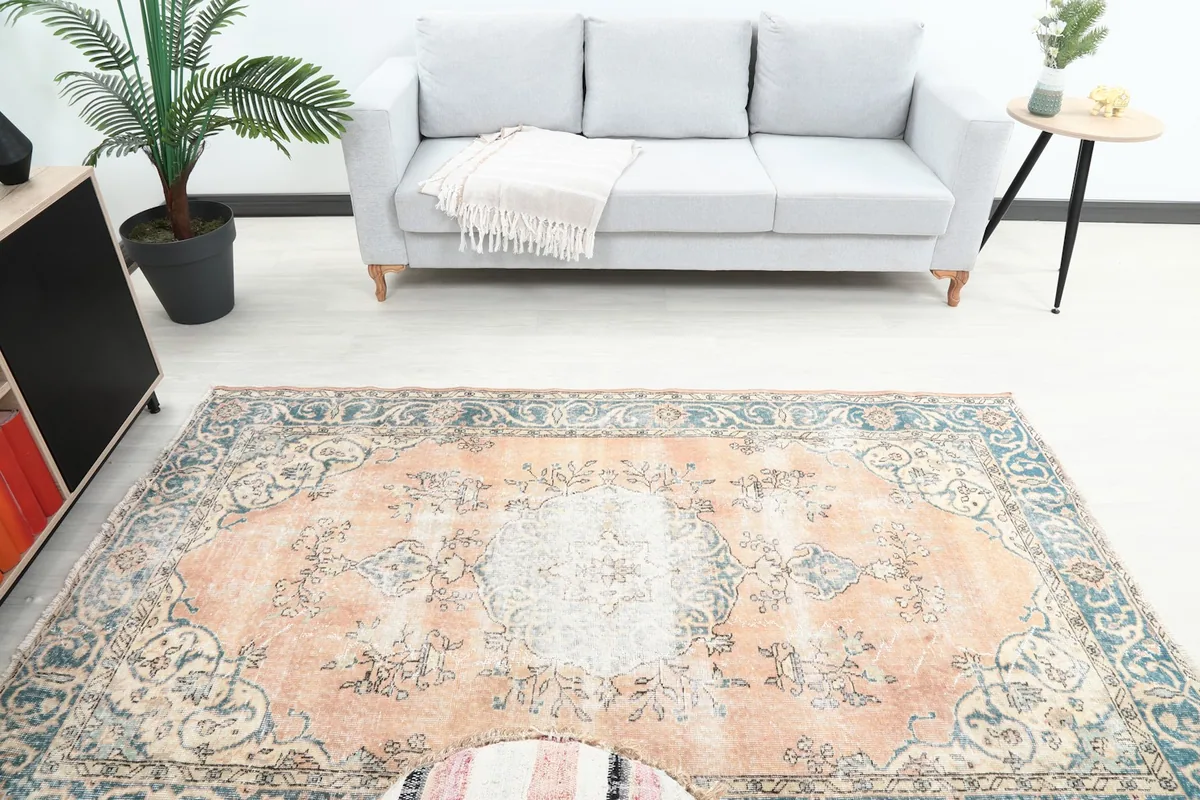 Overhead view of the rug in a room, showcasing its full design and colors in context.