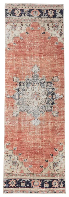 Full top view of the vintage Anatolian runner with a rust field and navy medallion on a white background