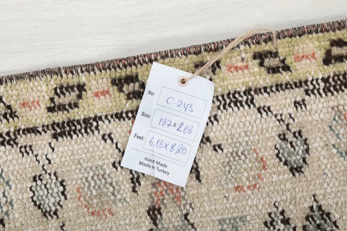 Close-up of the rug's label showing size and origin details