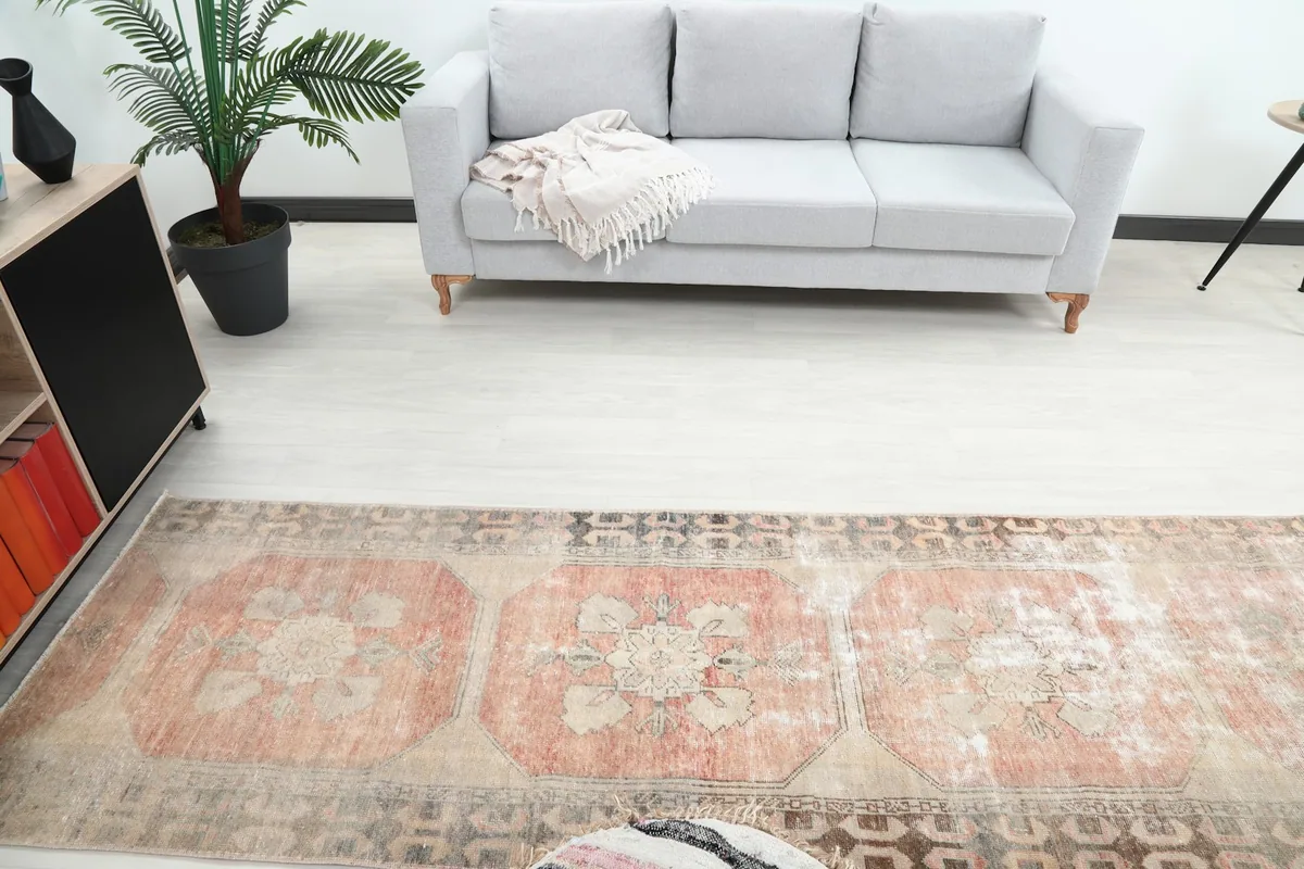 Overhead view of the runner in a room, highlighting its placement in front of a light gray sofa.