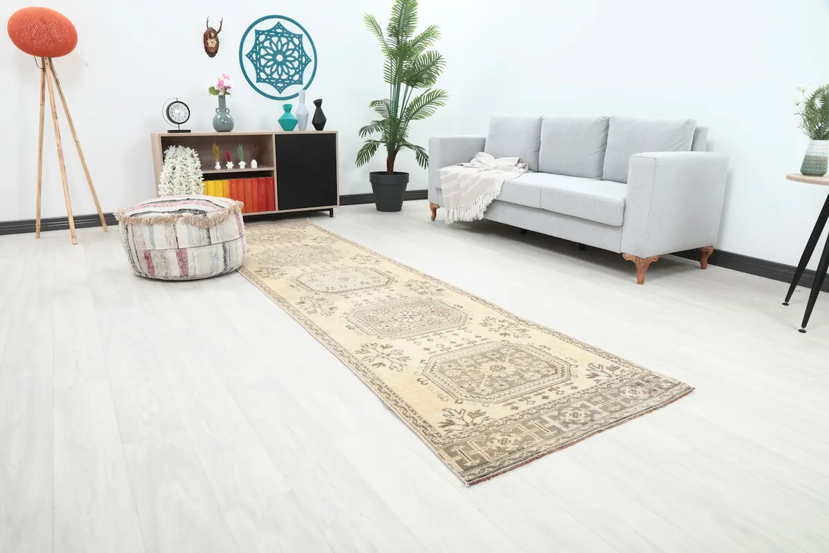 Angle view of the Anatolian runner rug in a living space, highlighting its length and geometric pattern