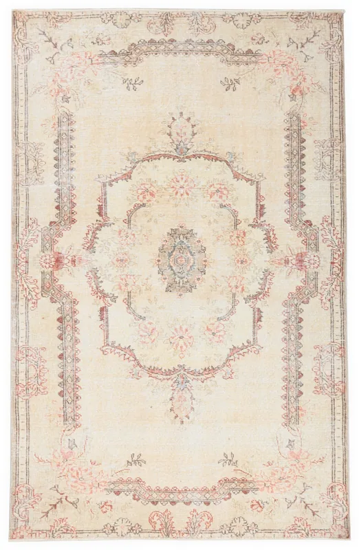Full overhead view of the ivory and rose vintage Anatolian rug on a white background