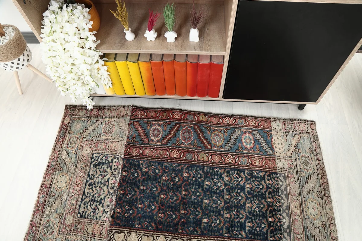 Close overhead view of the rug's patchwork design and varied patterns