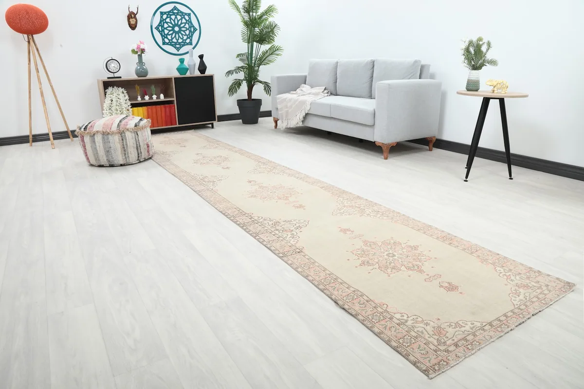 Runner rug extending through a living space, showing its length and pattern